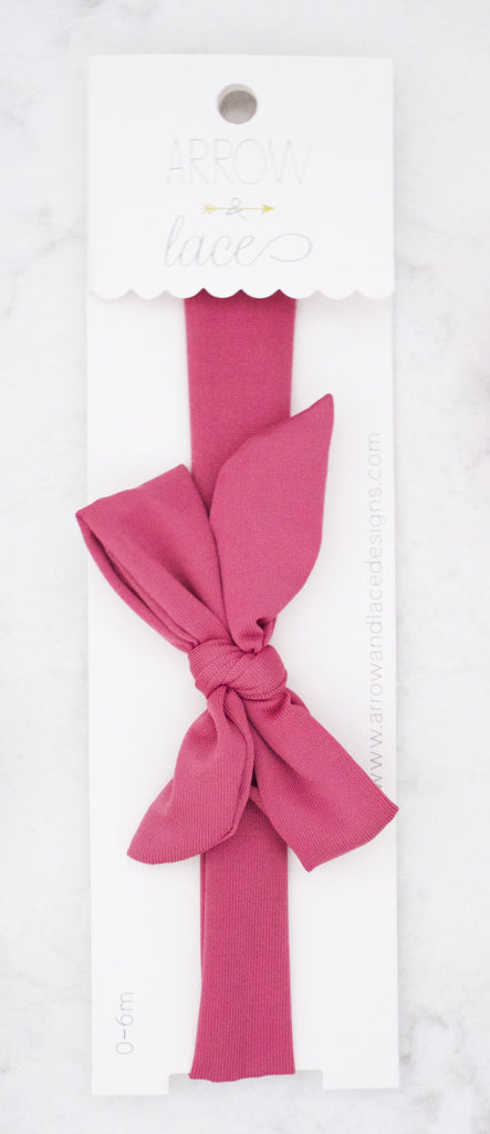 Pink bow on a white background