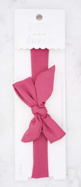 Pink bow on a white background