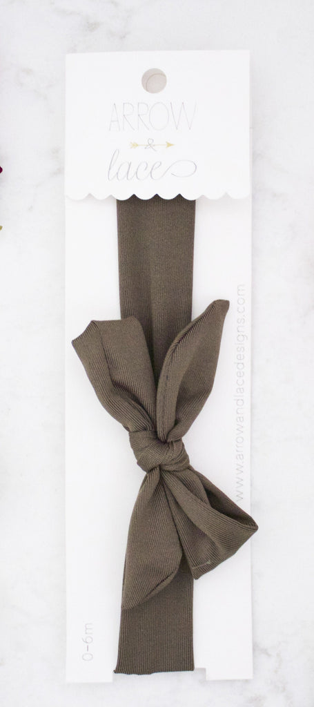 Olive hair bow on a white background